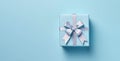 Banner with blue gift box with ribbon and bow for man and boy isolated on blue background.Holiday gift with Birthday or Christmas Royalty Free Stock Photo