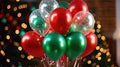 Banner with a bunch of red, green and gold helium balloons on a background of bokeh lights Royalty Free Stock Photo