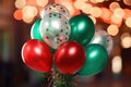 Banner with a bunch of red, green and gold helium balloons on a background of bokeh lights