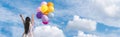 Banner Cheerful cute girl holding balloons running green meadow white cloud and blue sky with happiness. Panorama Hands holding