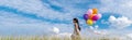 Banner Cheerful cute girl holding balloons running green meadow white cloud and blue sky with happiness. Panorama Hands holding