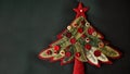 Banner with christmas tree applique with space for text. Christmas tree made of fabric, buttons isolated on dark green Royalty Free Stock Photo