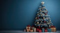 A banner with a Christmas tree with decorations and gifts in front of a blue wall Royalty Free Stock Photo