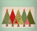 Banner with christmas trees applique. Christmas tree made of fabric, buttons isolated on white background. Handmade Royalty Free Stock Photo