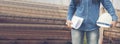 Banner Civil Engineer woman hands holding white hardhat worker helmet on Construction site. Panorama industry engineer woman hands