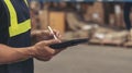 Banner Close up Hispanic men hands using pen touch smart tablet Warehouse management logistics counting checking products on