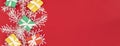 banner with Colorful scattered Christmas gifts. Red, green and yellow gifts on a redbackground with space for text