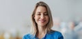 Banner of confident female doctor with closed eyes in hospital. Beautiful nurse wearing blue uniform, holding clipboard Royalty Free Stock Photo