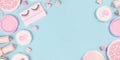Banner with cute pink makeup beauty products like brushes, powder or lipstick on sides of pastel blue background with empty copy s Royalty Free Stock Photo