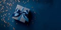 Banner with dark blue gift box with ribbon and bow for man and boy isolated on blue background.Holiday gift with Birthday or Royalty Free Stock Photo