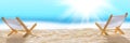 Banner 3:1. Deck chairs on sandy beach with blurry blue ocean and sun beams on sky. Social distancing or COVID-19 protection at Royalty Free Stock Photo