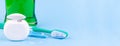 Banner with dental floss, toothbrush and mouthwash on blue background Royalty Free Stock Photo