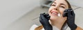 Banner for dental theme. Close-up of smiling woman with white teeth during medical examination. Concept of tooth whitening, Royalty Free Stock Photo