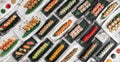 Banner with different sets of maki sushi rolls, nigiri and gunkan with tiger shrimp, tomago, salmon, tuna, chuka salad, tuna and Royalty Free Stock Photo