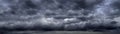 Banner Dramatic dark storm clouds black sky background. Dark thunderstorm clouds rainny season. Panorama Meteorology danger Royalty Free Stock Photo