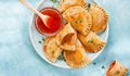 Banner Empanadillas, small filling tuna pies, tomato sauce, bell pepper, boiled egg. Close up. Mediterranean Spanish food Royalty Free Stock Photo
