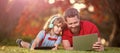 Banner of father on son school boy with laptop study online lying on grass, happy family of father and son use laptop Royalty Free Stock Photo