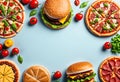 banner flat lay with copy space burger and pizza on blue background Royalty Free Stock Photo