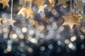 Banner with a garland of shiny stars made of gold paper, Christmas background with bokeh lights Royalty Free Stock Photo