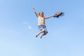 Banner with Girl in a jump against the blue sky with a school bag. Happy summer Royalty Free Stock Photo