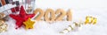 Banner golden numbers 2021 on snow, mirror disco ball and stars. Royalty Free Stock Photo