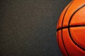 Banner with half of official orange leather basketball and dark black floor Royalty Free Stock Photo