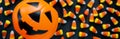 Banner with Halloween Background Candy corn candies, pumpkin basket. Traditional sweet Treats. Copy space Royalty Free Stock Photo