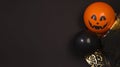 Banner. Halloween flat lay. Top view of witch hats, themed balls on a black background. An eerie holiday. Copy space Royalty Free Stock Photo