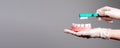 Banner with hands in gloves with toothbrush and jaw model. Professional tooth whitening. Dentist showing dental cleaning