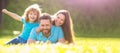 Banner of Happy family Lying on grass. Young mother and father with child son play in the park resting together on the Royalty Free Stock Photo