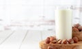 banner, hazelnut milk on white wooden table