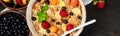 Banner of Healthy vegetarian breakfast. Oatmeal, granola with raspberries