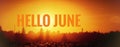 Banner hello june. Text on the photo. Text hello June. New month. New season. Summer month. Text on sunset photo Royalty Free Stock Photo