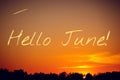 Banner hello june. Text on the photo. Text hello June. New month. New season. Summer month. Text on sunset photo Royalty Free Stock Photo