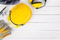 Banner image of construction safety equipment flat lay on white wooden Royalty Free Stock Photo