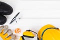 Banner image of construction safety equipment flat lay on white wooden Royalty Free Stock Photo