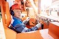 Banner industrial man holding hard hat on background of excavator. Concept of job placement for drivers of construction