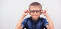 Banner little boy with glasses correcting myopia close-up portrait Ophthalmology problem selective focus Royalty Free Stock Photo