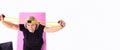 Banner, long format. Above high view senior woman fitness training, stretching resistance band online home at laptop. Blonde on Royalty Free Stock Photo