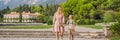 BANNER, LONG FORMAT Mom and son tourists walking together in Montenegro. Panoramic summer landscape of the beautiful Royalty Free Stock Photo