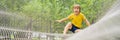 BANNER, LONG FORMAT practice nets playground. boy plays in the playground shielded with a protective safety net. concept Royalty Free Stock Photo