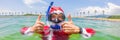 BANNER, LONG FORMAT Santa claus is snorkeling underwater - christmas or happy new year concept. Christmas in the tropics Royalty Free Stock Photo