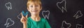 BANNER, LONG FORMAT Six-year old boy shows myofunctional trainer. Helps equalize the growing teeth and correct bite Royalty Free Stock Photo