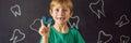 BANNER, LONG FORMAT Six-year old boy shows myofunctional trainer. Helps equalize the growing teeth and correct bite Royalty Free Stock Photo