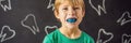 BANNER, LONG FORMAT Six-year old boy shows myofunctional trainer. Helps equalize the growing teeth and correct bite Royalty Free Stock Photo