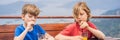 BANNER, LONG FORMAT Two boys friend drink juice, enjoys the view of Kotor. Montenegro. Bay of Kotor, Gulf of Kotor, Boka