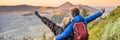 BANNER, LONG FORMAT Young couple man and woman meet the sunrise at the Bromo Tengger Semeru National Park on the Java