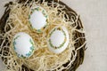 banner a lot of space for text coffee background Easter eggs decorated with painted embroidery ribbons on eggshell in