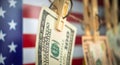 Banner money laundering with US dollars hung out to dry on American flag background. Dollar bills hanging on clothesline Royalty Free Stock Photo