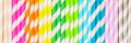 Multi-colored straw paper tubes on a bright yellow pastel background. Top view, copy space Royalty Free Stock Photo